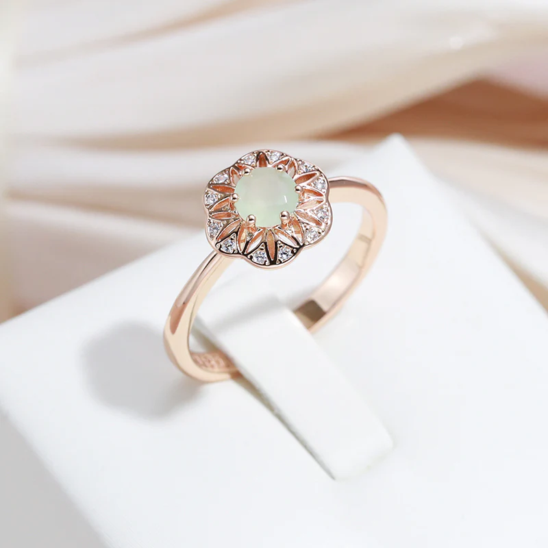 Elegant ring with green crystal in the bell