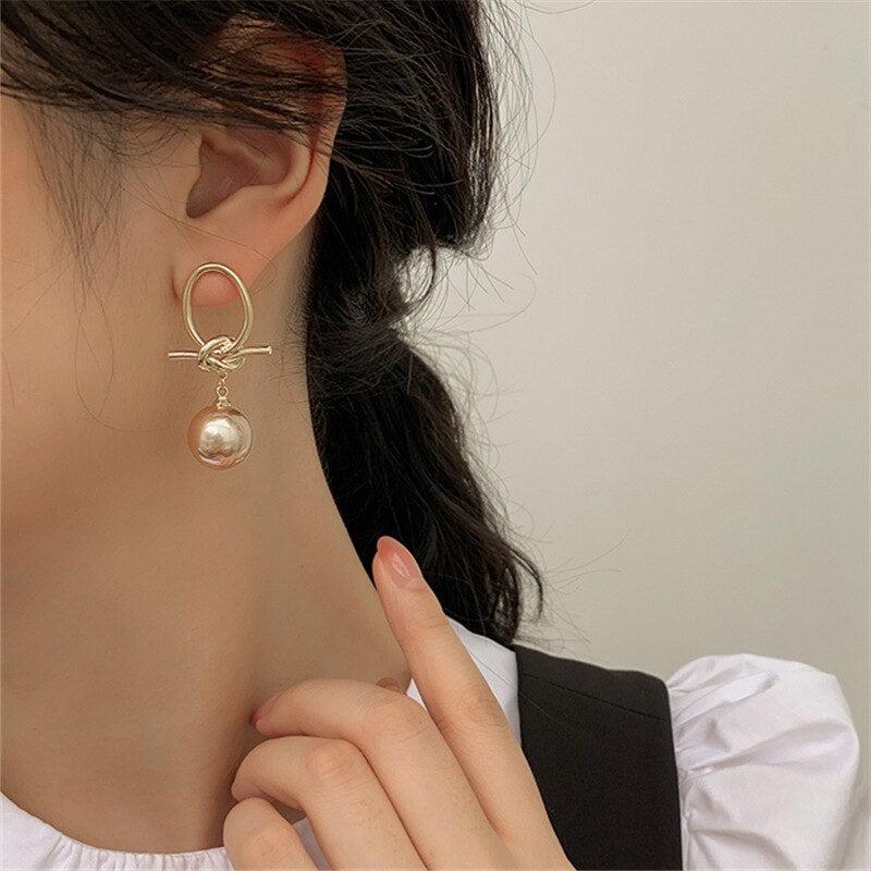 Gold Pearl Loop Earrings - Image 4