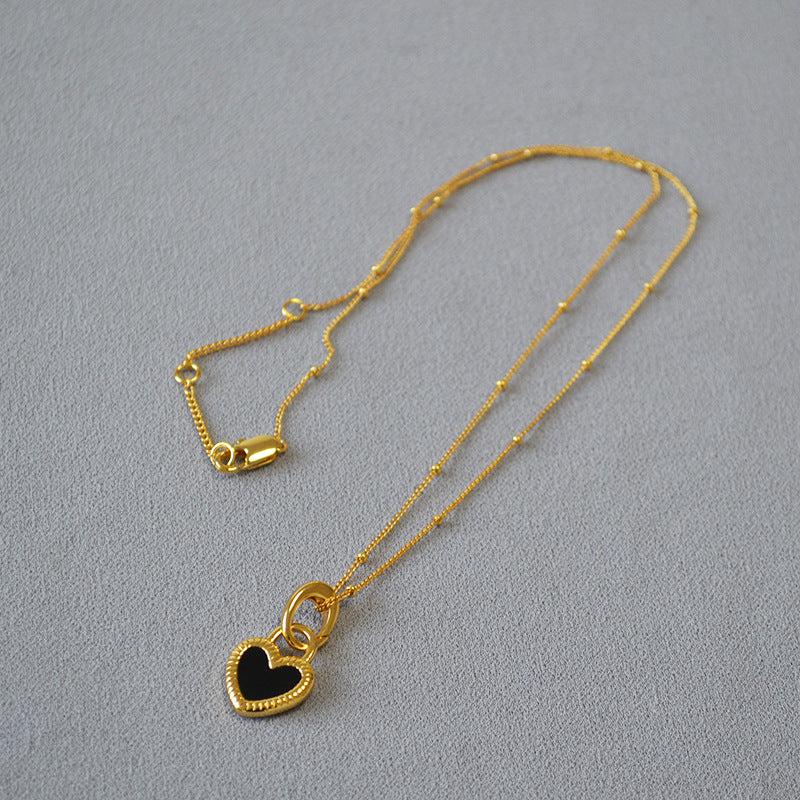 Black and White Heart Necklace in Gold - Image 3