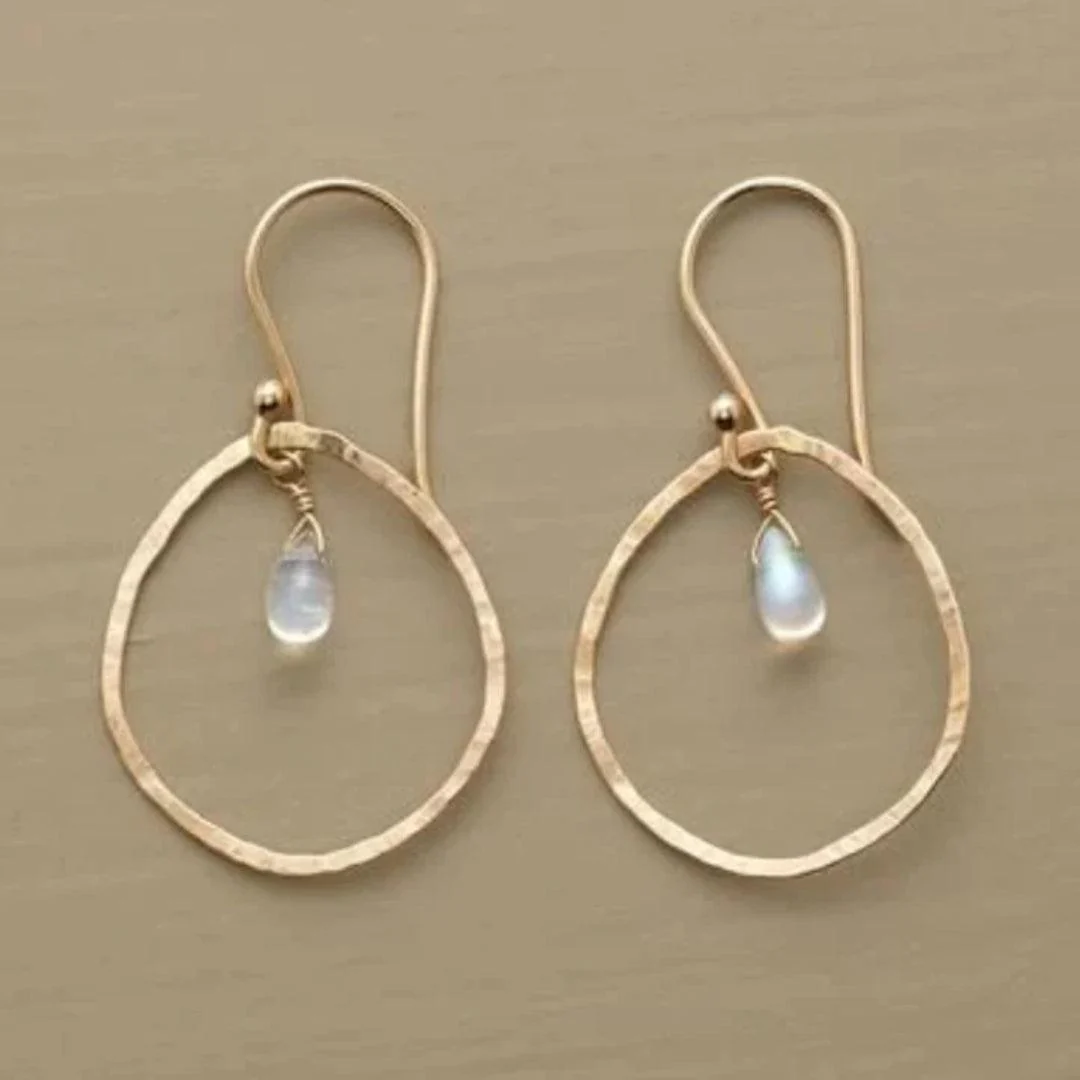 Vintage earrings made of white crystal in gold